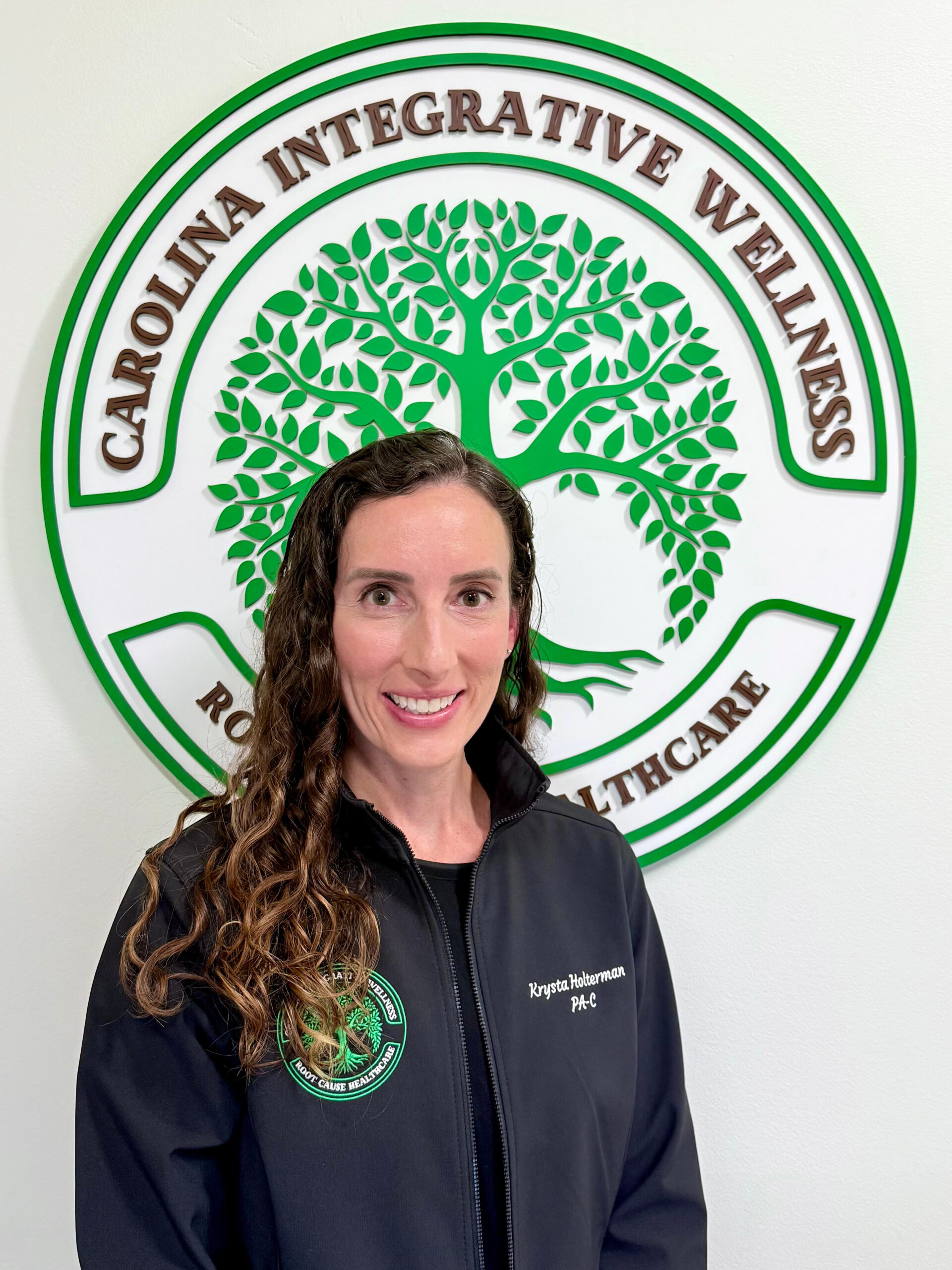 Krysta Holterman Krysta Holterman photo in front of Carolina Integrative Wellness logo